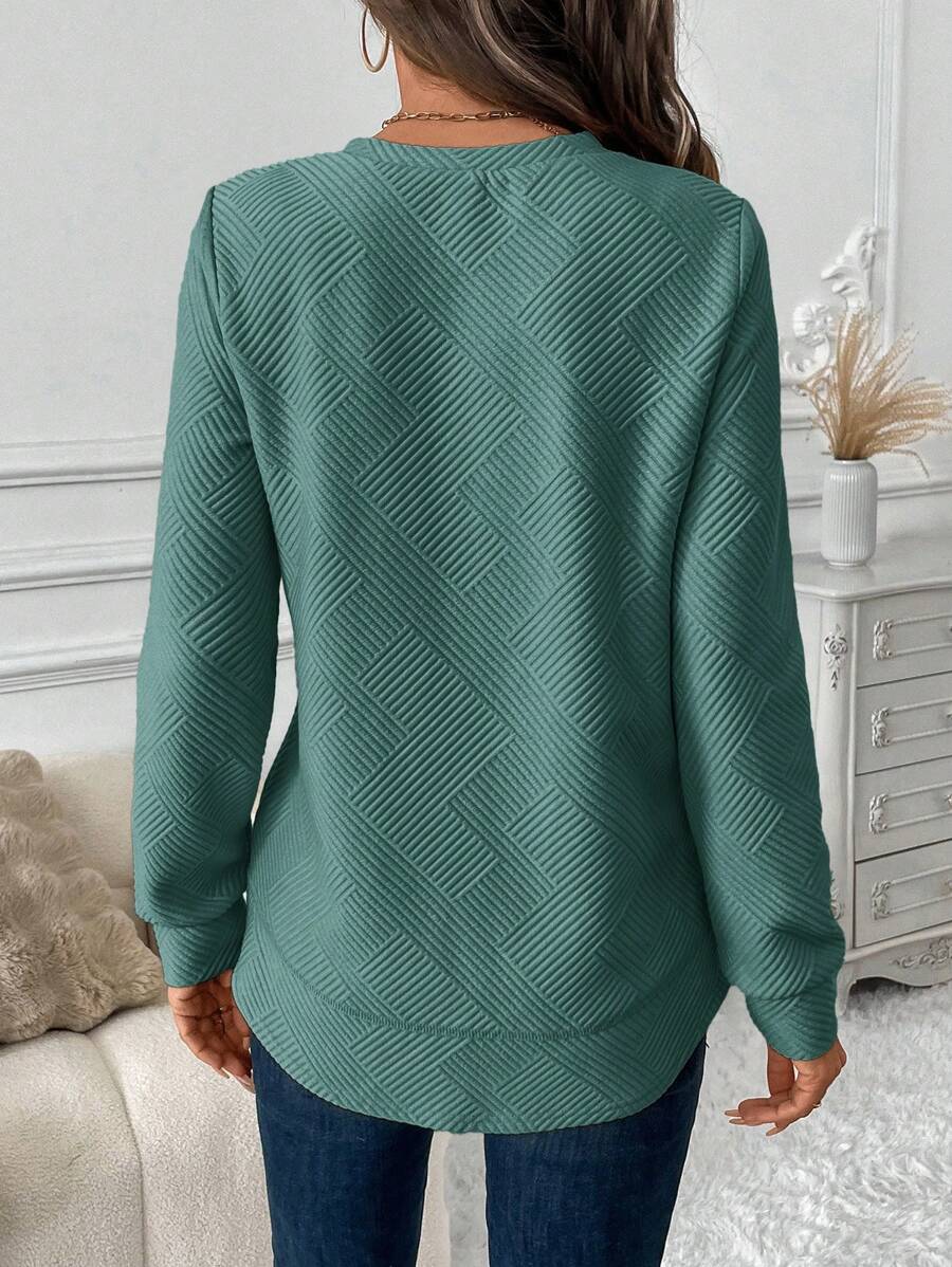 Blusa em Alto Relevo e Manga Longa
